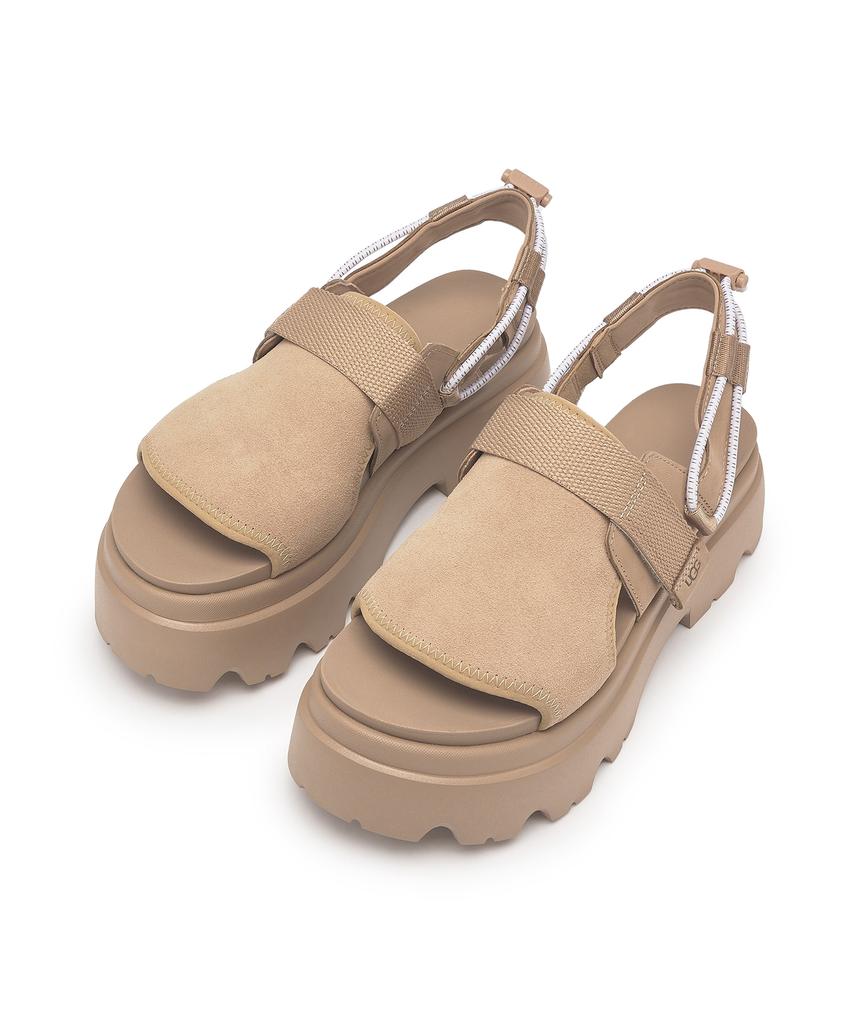 Ugg [Women] Caddy - Sand / 1156430-San