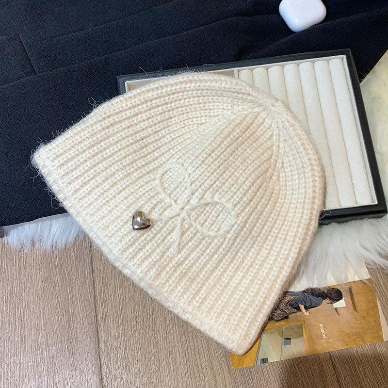 Bow knitted hat women s new sweet and cool fashionable ear protector wool hat shows a small cold hat M（56-58cm） бежевый