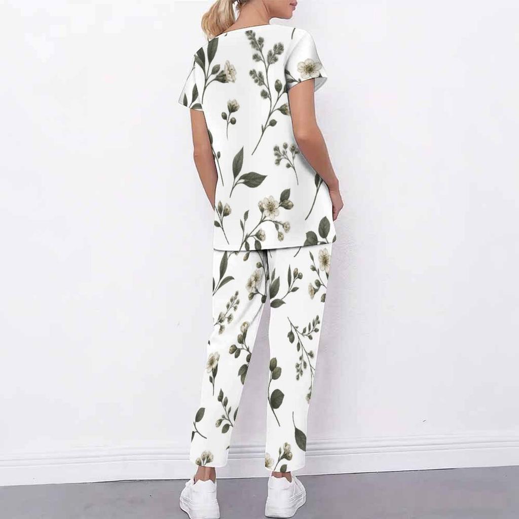 Women Plus Size White Floral Printed Scrub Set Crisscross Cutout Neck Short Sleeve Top With Pockets Long Pants Two Piece