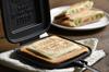in TSBBQ Hot Sandwich Maker Keeps bread crusts together and prevents filling from spilling Stylish logo Separates to be used as a frying pan and easy