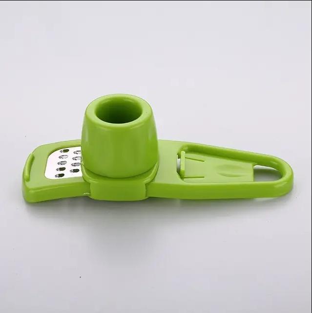 1ks balení Mini mlýnek na česnek Creative Lis na česnek Kuchyňská česneková kaše Ruční šťouchání česneku Zelené kuchyňské pomůcky