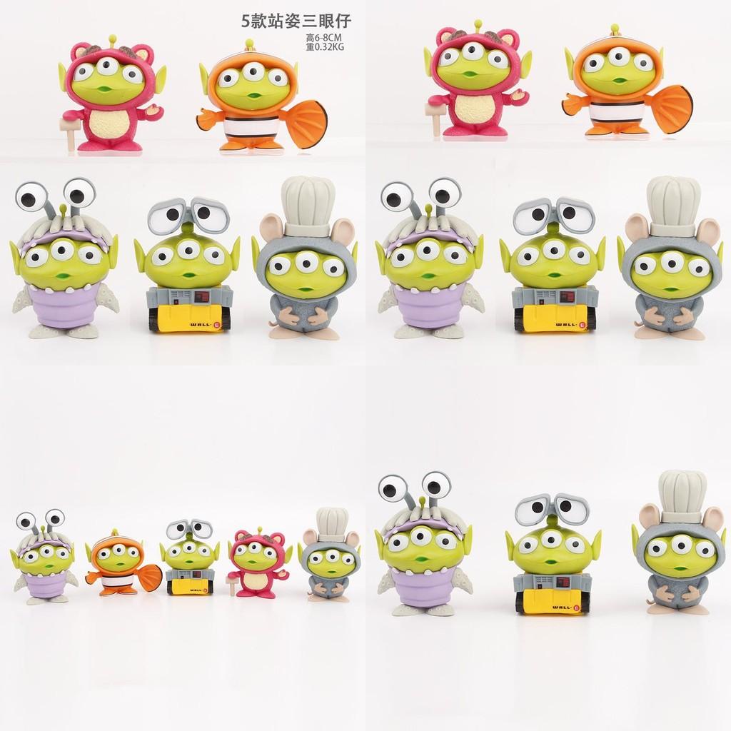 Adorable Three-eyed Alien Figurine In Various Character Costumes Fun Collectible