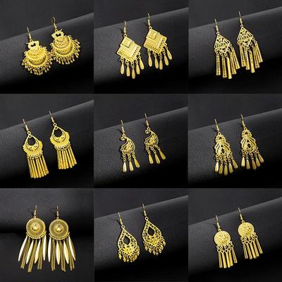 Bohemian Peacock Earrings with Golden Bell Tassels and Leaf Pendants.