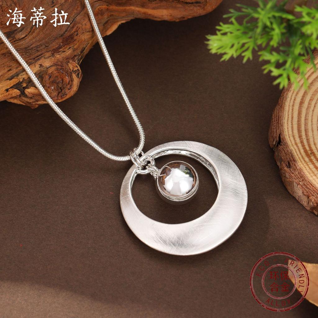 New brushed hollow ring ball pendant, women's fashion high sense hollow round necklace