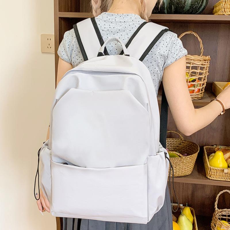 Junior high school backpack large capacity solid color backpack male simple versatile high school college student schoolbag female