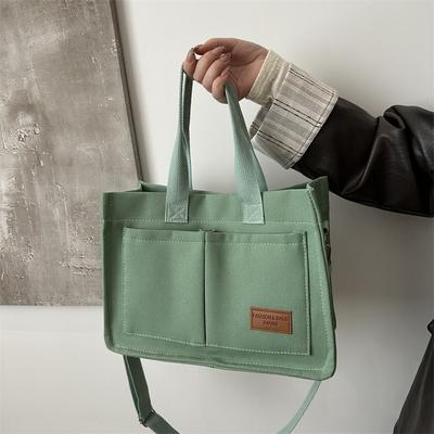Sac en toile sens du design niche nouveau grande capacité épaule paresseux portable fourre-tout sac en toile vent