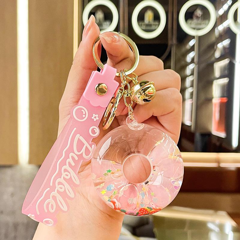 Luminous Oil-Filled Donut Quicksand Keychain: Exquisite Car Pendant & Bag Accessory, Ideal for Gifts.