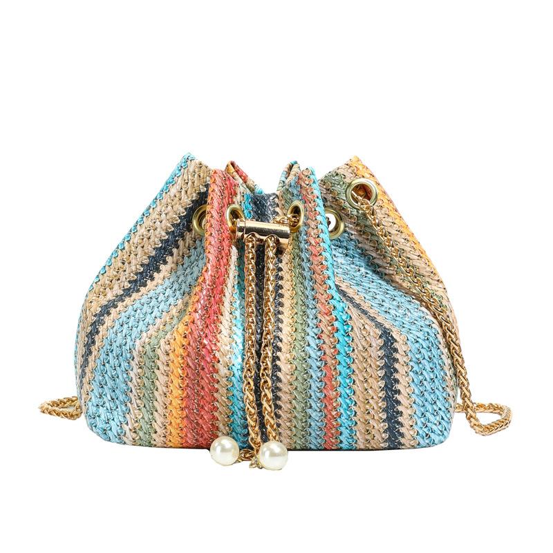 

Fresh and sweet rainbow woven messenger bag New fashion Japanese trend pearl pendant One shoulder diagonal span bag синій