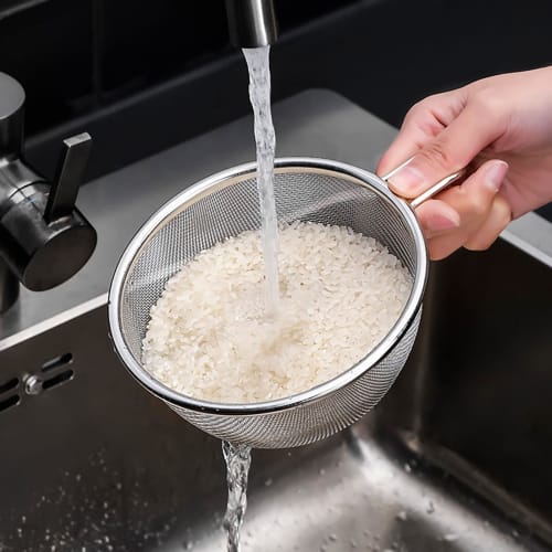 Stainless steel colander and bowl set with handles, perfect for draining rice and other dishes. Also includes a colander and bowl. Perfect for fruit,