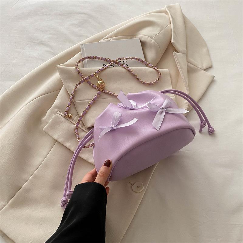 

2025 summer model, bow small fresh draw belt large capacity soft surface pleated chain bucket crossbody shoulder women s bag фиолетовый