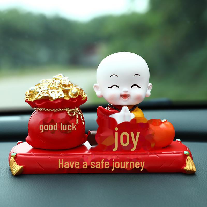 Creative Little Monk Maitreya Buddha Car Ornament: Cute, Shaking Head Resin Doll for Car Interior Decoration and Safety.