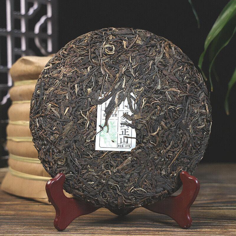 Yiwu Zhengshan Tee Blumenduft Pu'er Teekuchen Siebensamenkuchen Tee 357g