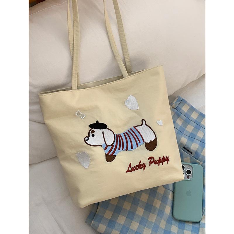 Canvas Bag Design Sense Niche Underarm Bag Women 2025 New Simple Cartoon Puppy Tote Bag Shoulder Bag Portable