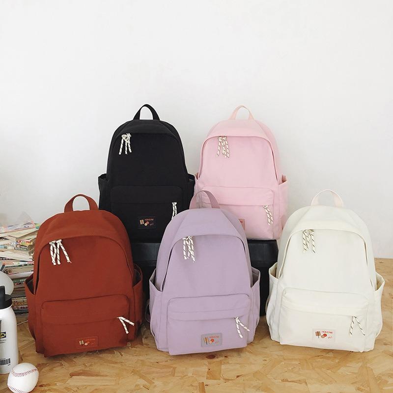 New casual simple solid color backpack large capacity junior high school student schoolbag