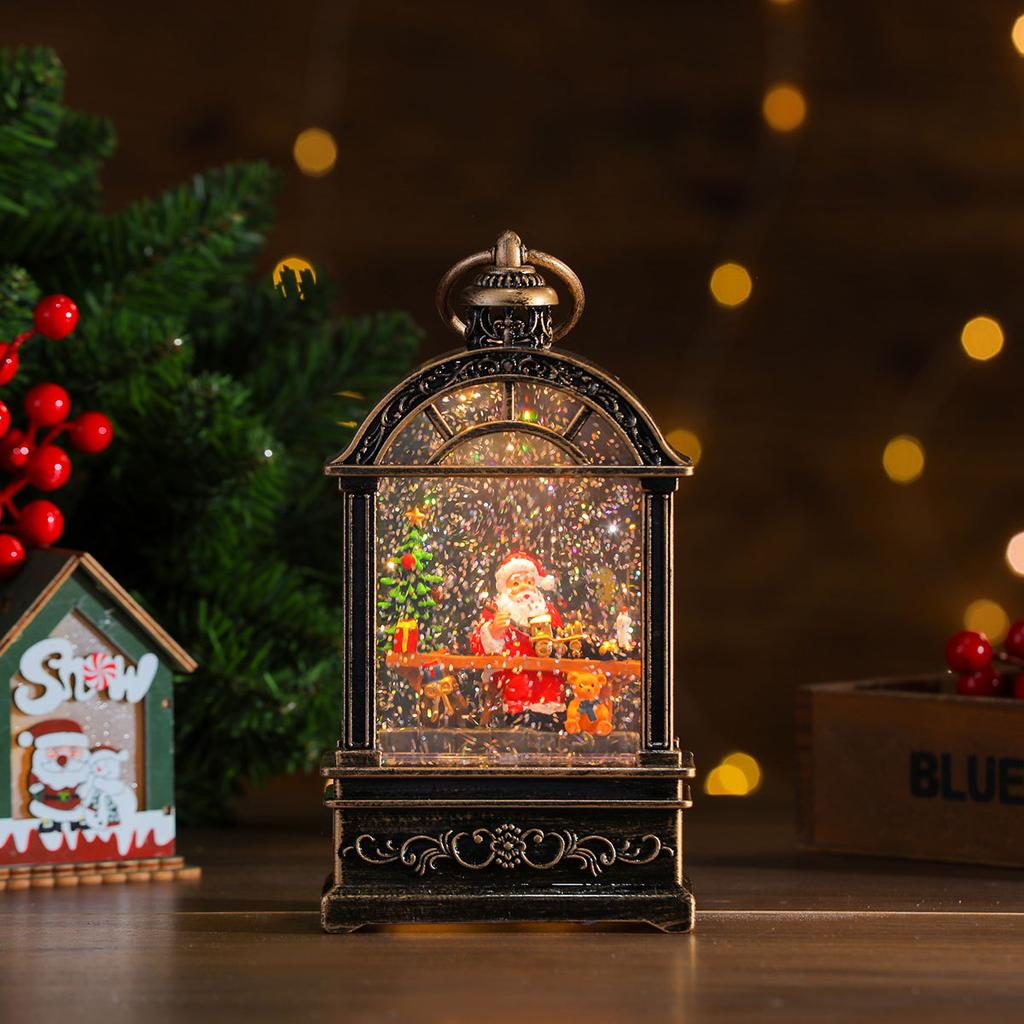 O varietate de apă de Crăciun umplută cu ornamente muzicale, cabine telefonice, lămpi cu ulei, lumini de vânt, decorațiuni de Crăciun, cadouri de Crăciun