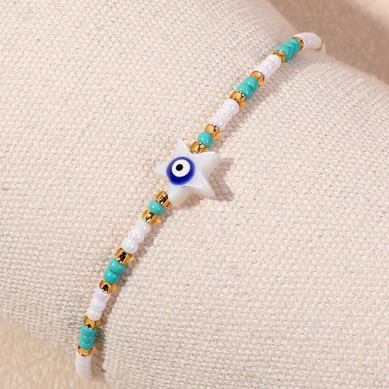 Bracelet en perles d'œil du diable tissé à la main avec motif de niche en verre