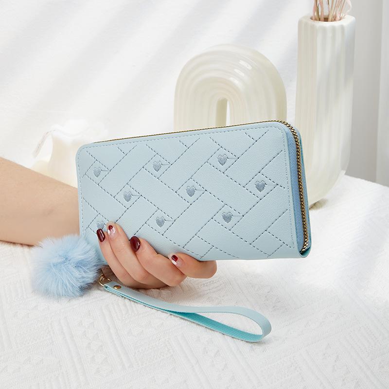 Spring and summer new women's wallet indentation medium and long clutch bag trendy love hairball change mobile phone bag