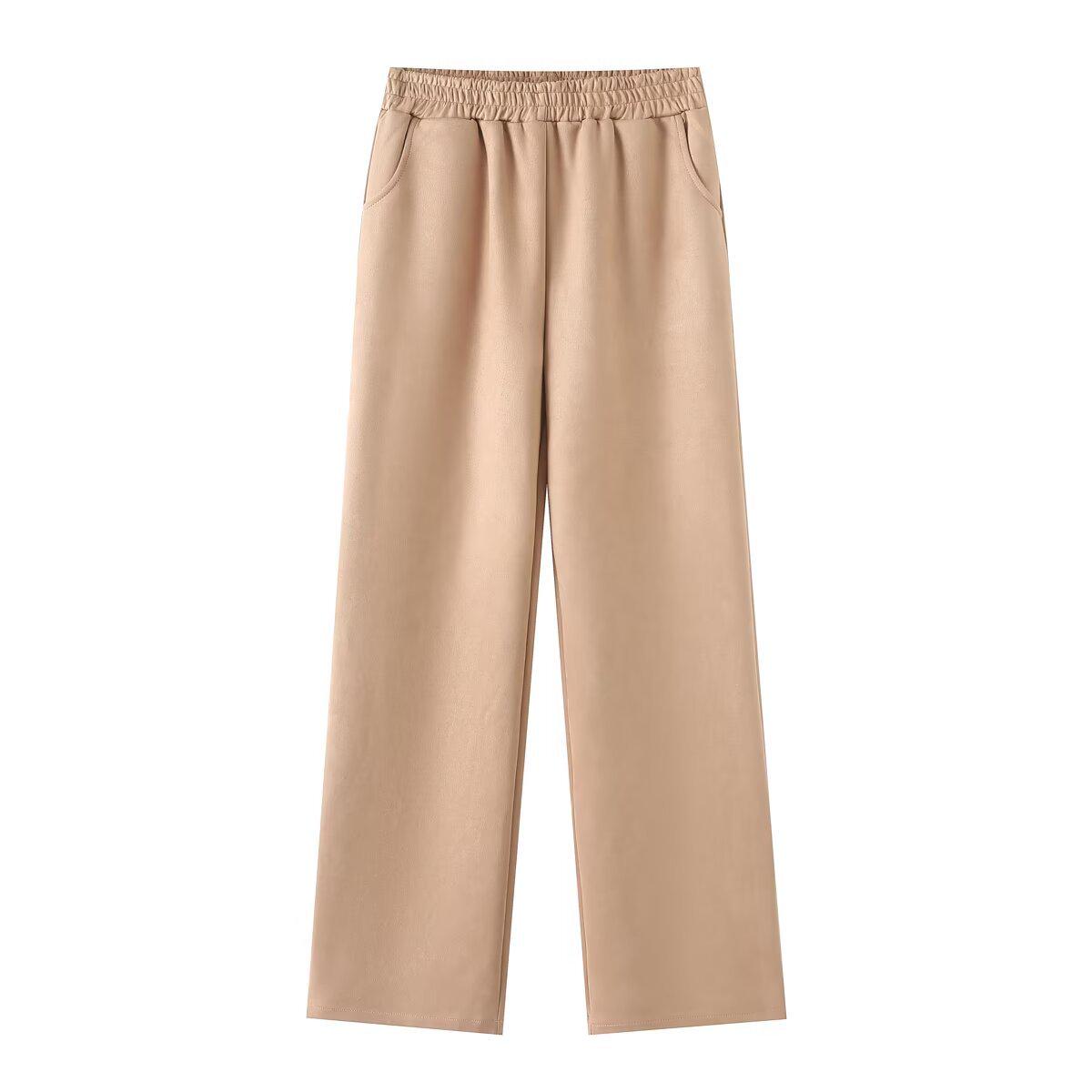 

Женский комплект из замшевой куртки с лацканами и прямых брюк на резинке L