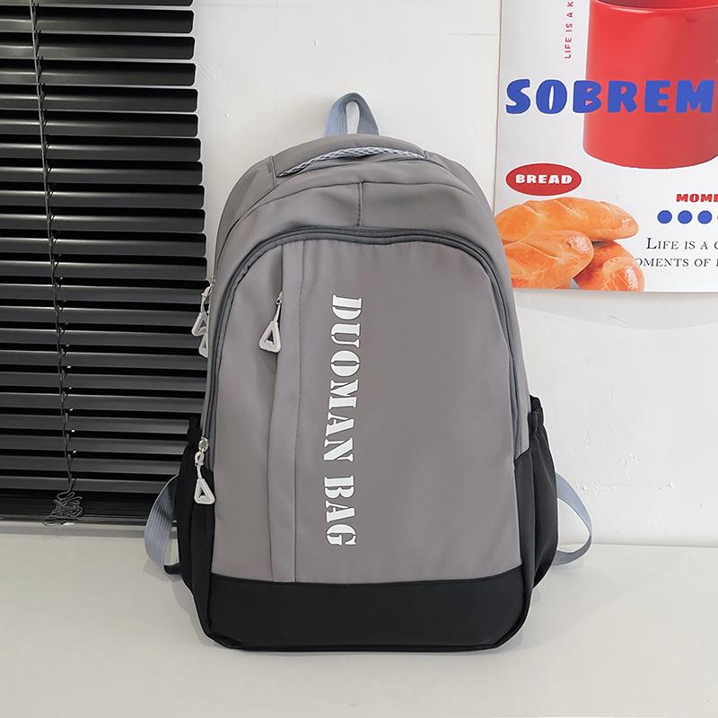Schoolbag schoolbag 1011 summer new Korean version simple anti-theft contrasting color backpack junior high school college student shoulder back