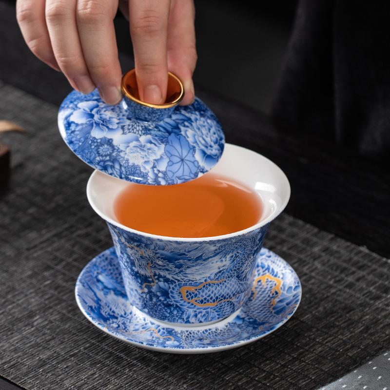 Chinese hoverable cover bowl blue and white gold and silver wrong suet jade porcelain three-color cover bowl Kung Fu household cover bowl tea bowl