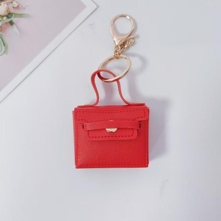 Cross-border solid color small square bag creative gift mouth red envelope keychain earphone bag car pu key chain pendant wholesale