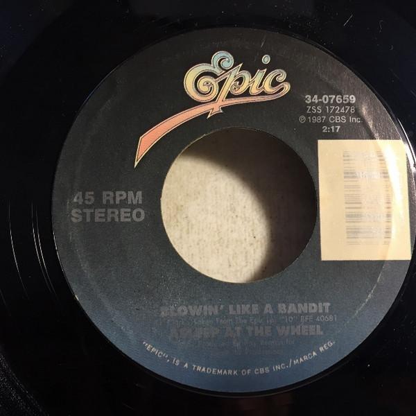

7inch Record ASLEEP AT THE WHEEL - Blowin Like A Bandit 3407659 Epic 1987 US Folk Used
