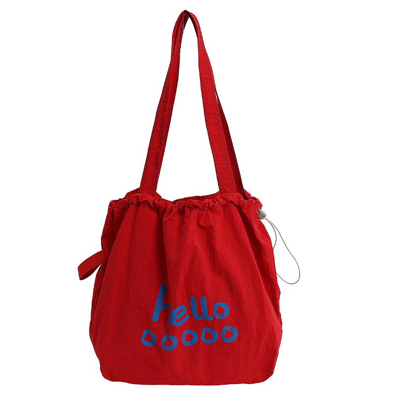 

Korean version 2025 new letter printing casual large-capacity tote bag light travel lazy wind shoulder stray bag красный
