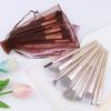 9 makeup brushes set, mesh sandbag, eye brush, loose powder brush, fan brush, highlight blush, detail brush, beauty tool.