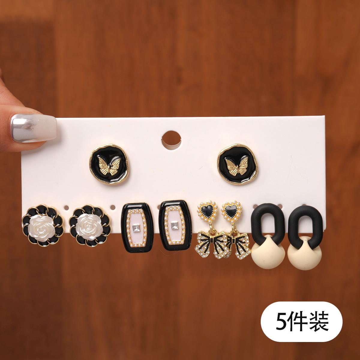 

Ten-piece set of acrylic dripping oil flower love geometric silver needle stud earrings retro earrings