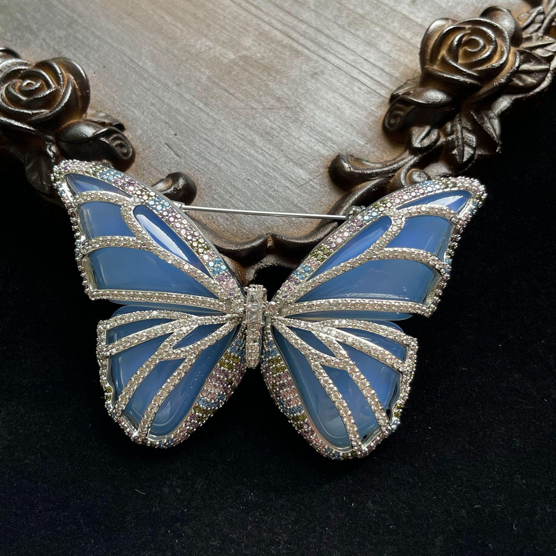 

Vintage Silver-Plated Blue Butterfly Brooch with Full Diamond Accents
