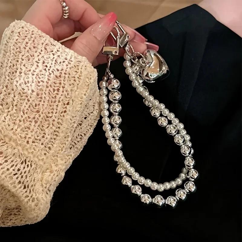 

Ins Cold and Simple Imitation Pearl Double Chain Love Phone Chain Suitable for Phone Cases Universal Hanging Chain Camera Chain срібні білого кольору