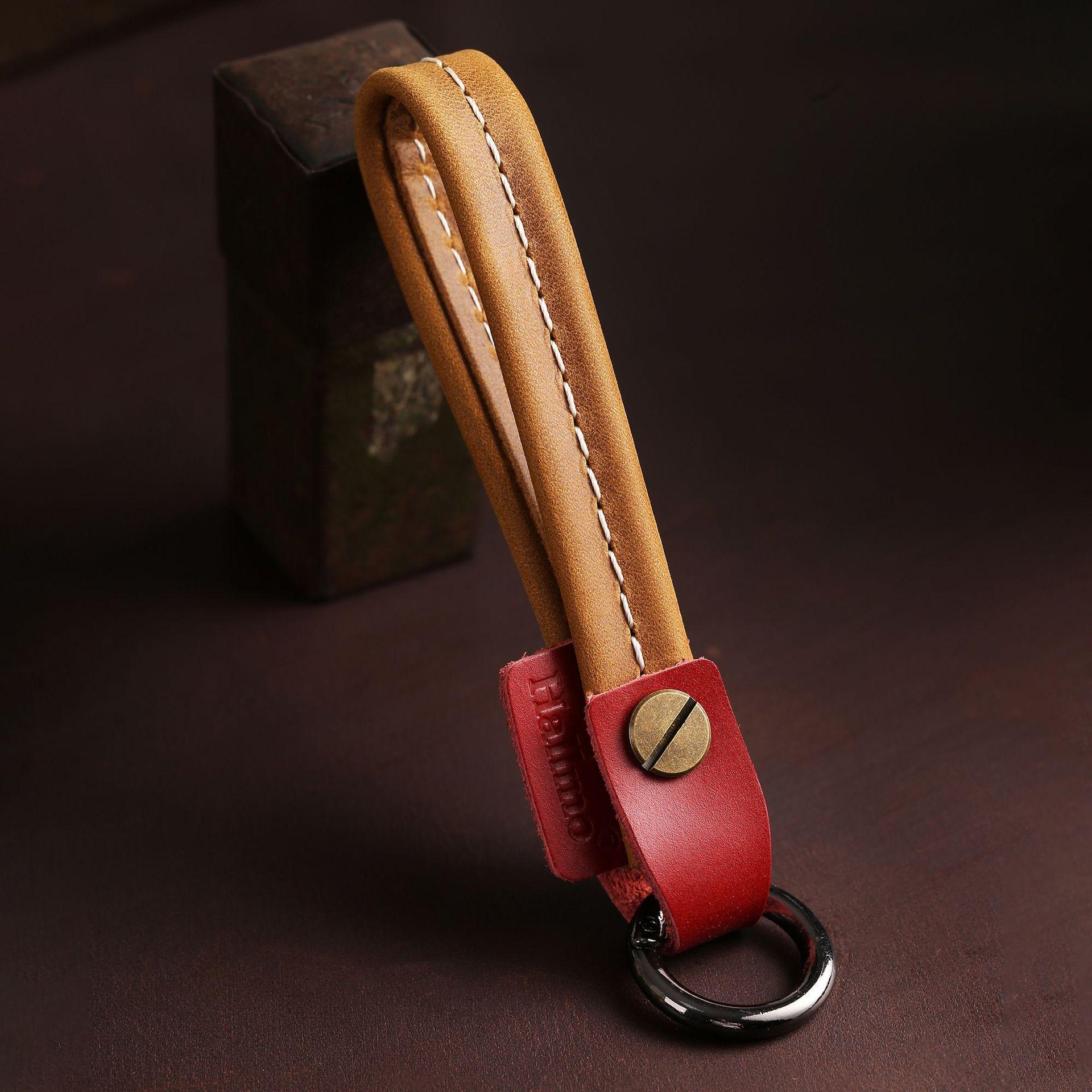 

Retro creative car keychain wholesale leather long key rope high-end gift box personalized car keychain chain темно-коричневого