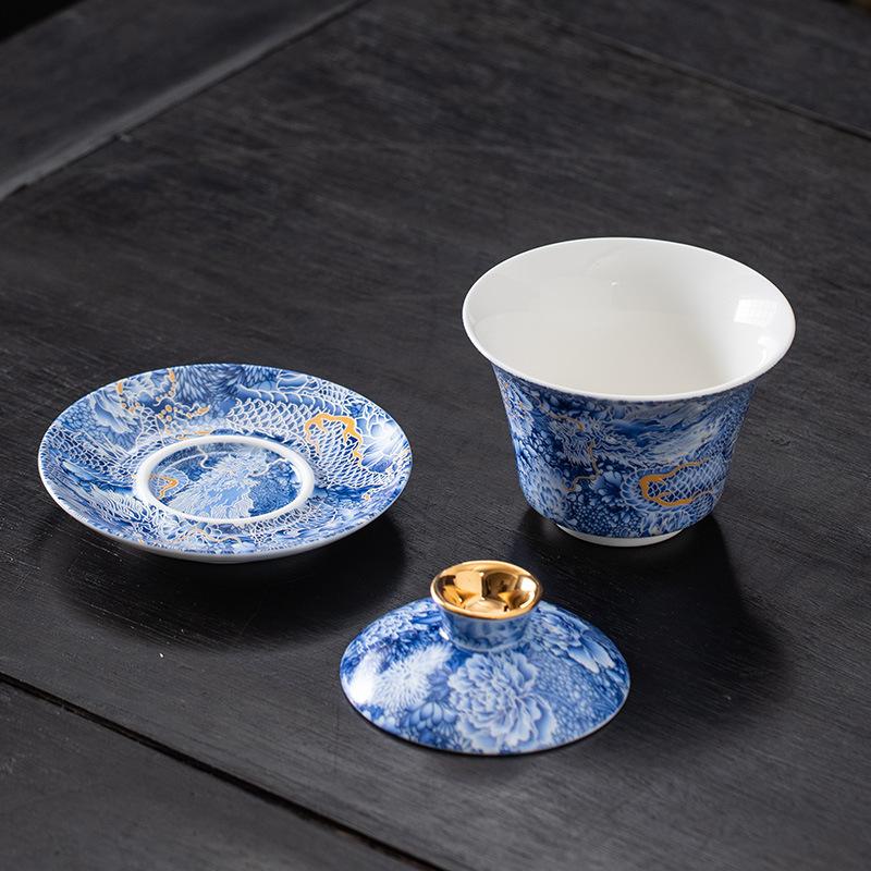 Chinese hoverable cover bowl blue and white gold and silver wrong suet jade porcelain three-color cover bowl Kung Fu household cover bowl tea bowl