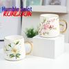 Qianxing Ceramic Plum Blossom Mug with Gold Handle