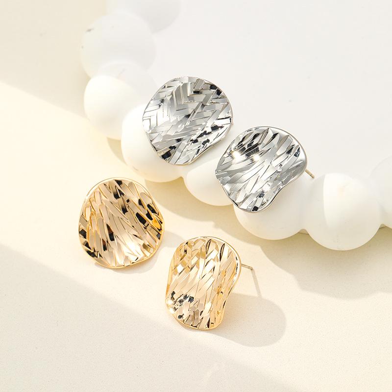 Irregular Crushed Ice Metal Stud Earrings: Luxurious French Design for Women.