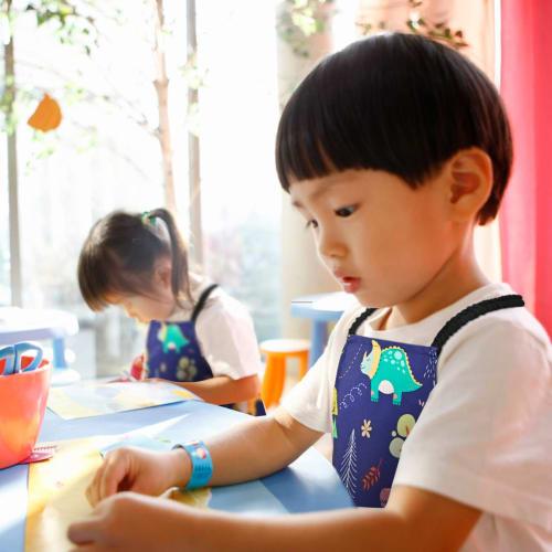 Athbavib Kids' Apron, Cute Dinosaur, Navy, with Triangle Scarf and Pockets, Adjustable, 50*60cm, Waterproof Cotton, Easy Care, for Boys and Girls, Kin