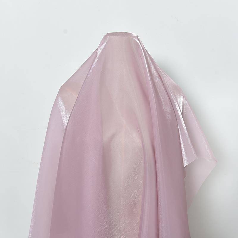 Shimmering satin encrypted solid color organza fabric suitable for wedding dresses formal gowns and designer clothing fabrics