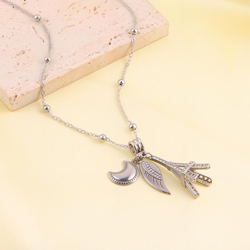 

Діамантове кольє Ейфелева вежа з підвіскою Місяць та Крила з титанової сталі