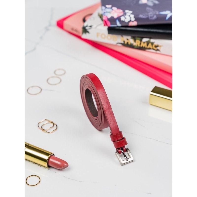 Classic, narrow women's belt with a silver metal buckle