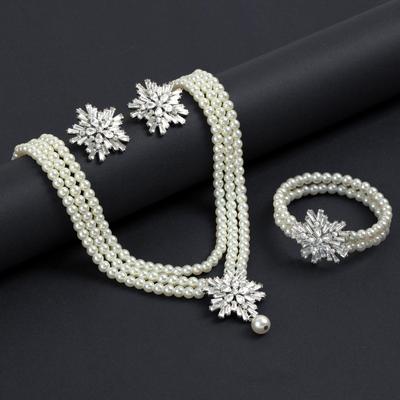 Snowflake Pearl Jewelry Set: Necklace, Bracelet, and Earrings for Women - Trendy High-End Fashion.