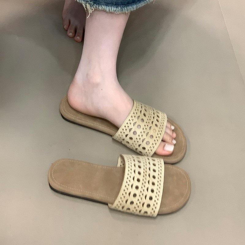 Ethnic style hollow cool slippers women's summer beach slippers 2025 new one-word drag niche