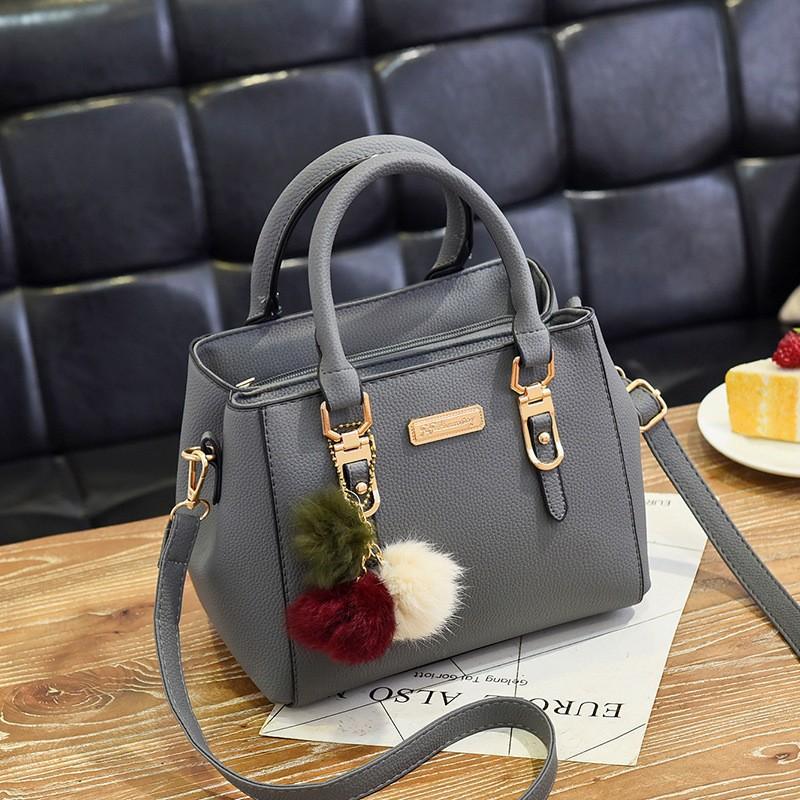 Fashion versatile women's handbag simple large-capacity messenger bag double-layer hairball shoulder bag bags