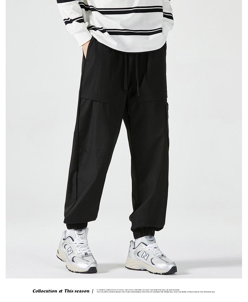 Men's American-Style Autumn Overalls: Fashionable, Casual, Versatile Nine-Point Pants with Loose Cuffs and Multi-Pocket Design.