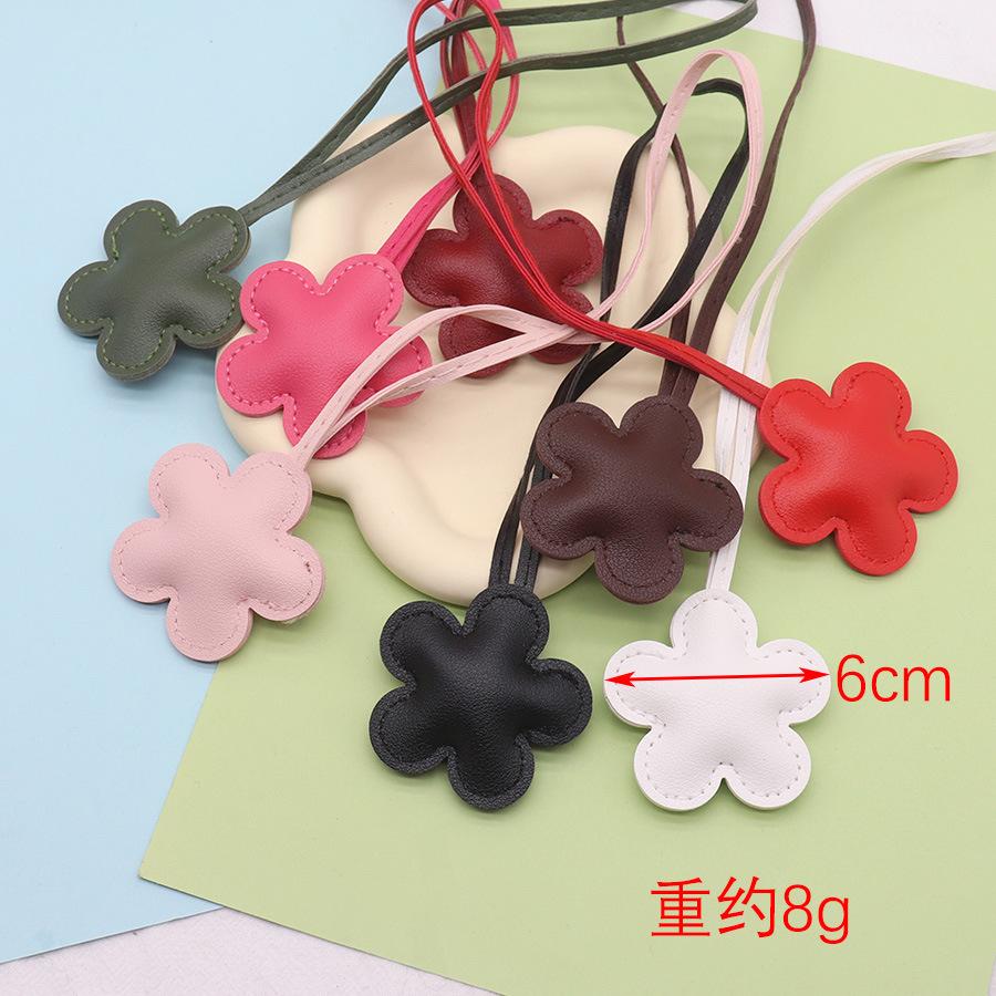 Cross-border European and American new flower leather bag pendant DIY accessories cute car pendant keychain jewelry spot Leather terms