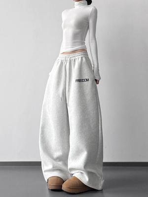 2026 Damen Herbst/Winter Lässige High-Waist Jogginghose mit Kordelzug - Schlankmachende Weitbeinige mit Buchstaben-Print