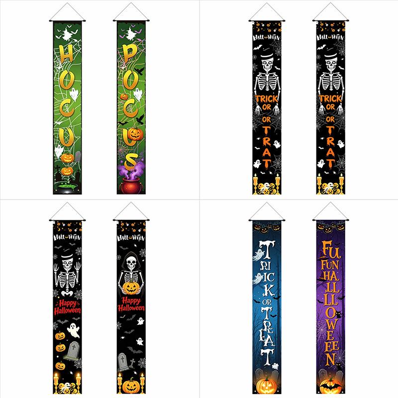 Halloween flags decorate the courtyard for an outdoor party. Cartoon doors hang with festive backdrop cloth. Halloween couplets.