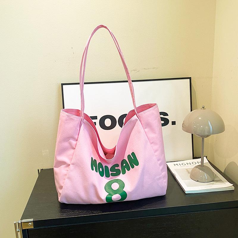 

Casual commuter canvas bag women s 2024 new trendy summer large-capacity shoulder bag slack underarm tote bag рожевий