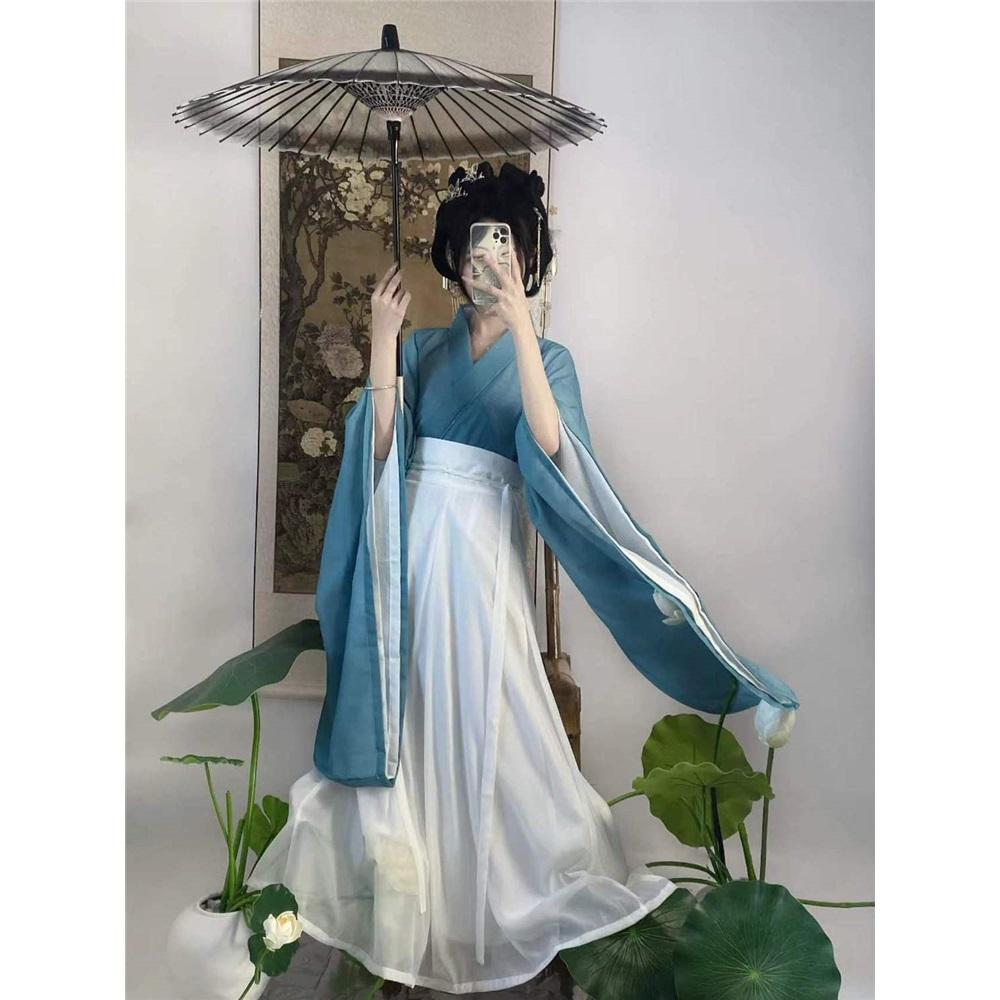 Tre-delat set med korshalsad midjelång kjolstil från Wei- och Jin-dynastierna för kvinnor