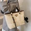 Höst och vinter ny enkel stil nischmode hög känsla toteväska dam pendlar stor kapacitet axelväska