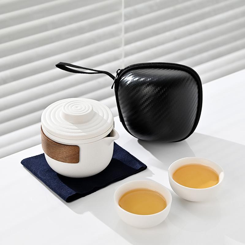 

Travel tea set, ceramic express cup, portable one pot, two cups, gift storage bag, a complete set of gifts.